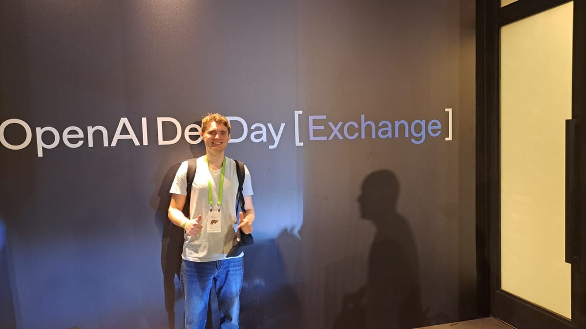 At the OpenAI DevDay Exchange wall.